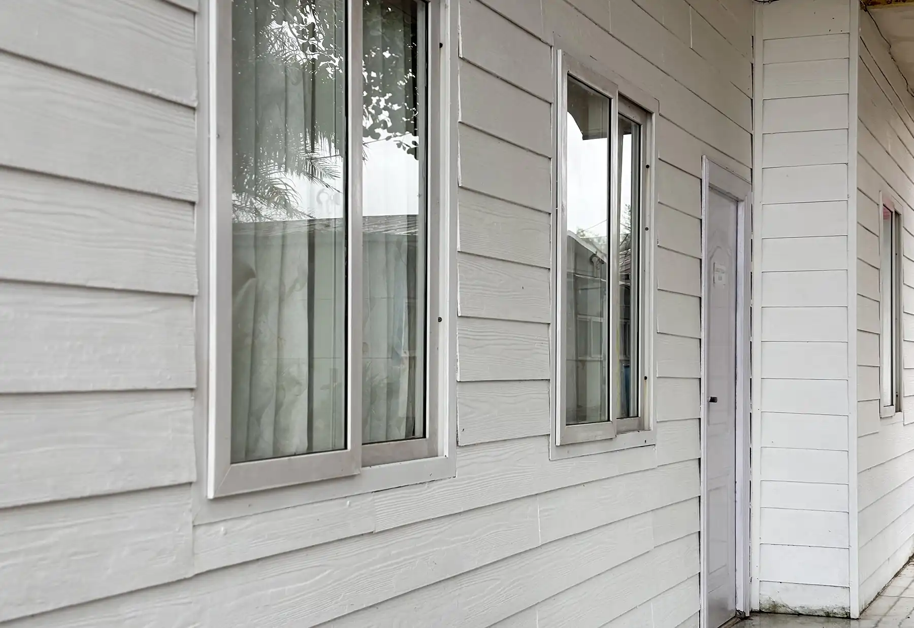 Обшивка фасада дома вагонкой Американка